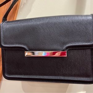 Black structured shoulder bag.